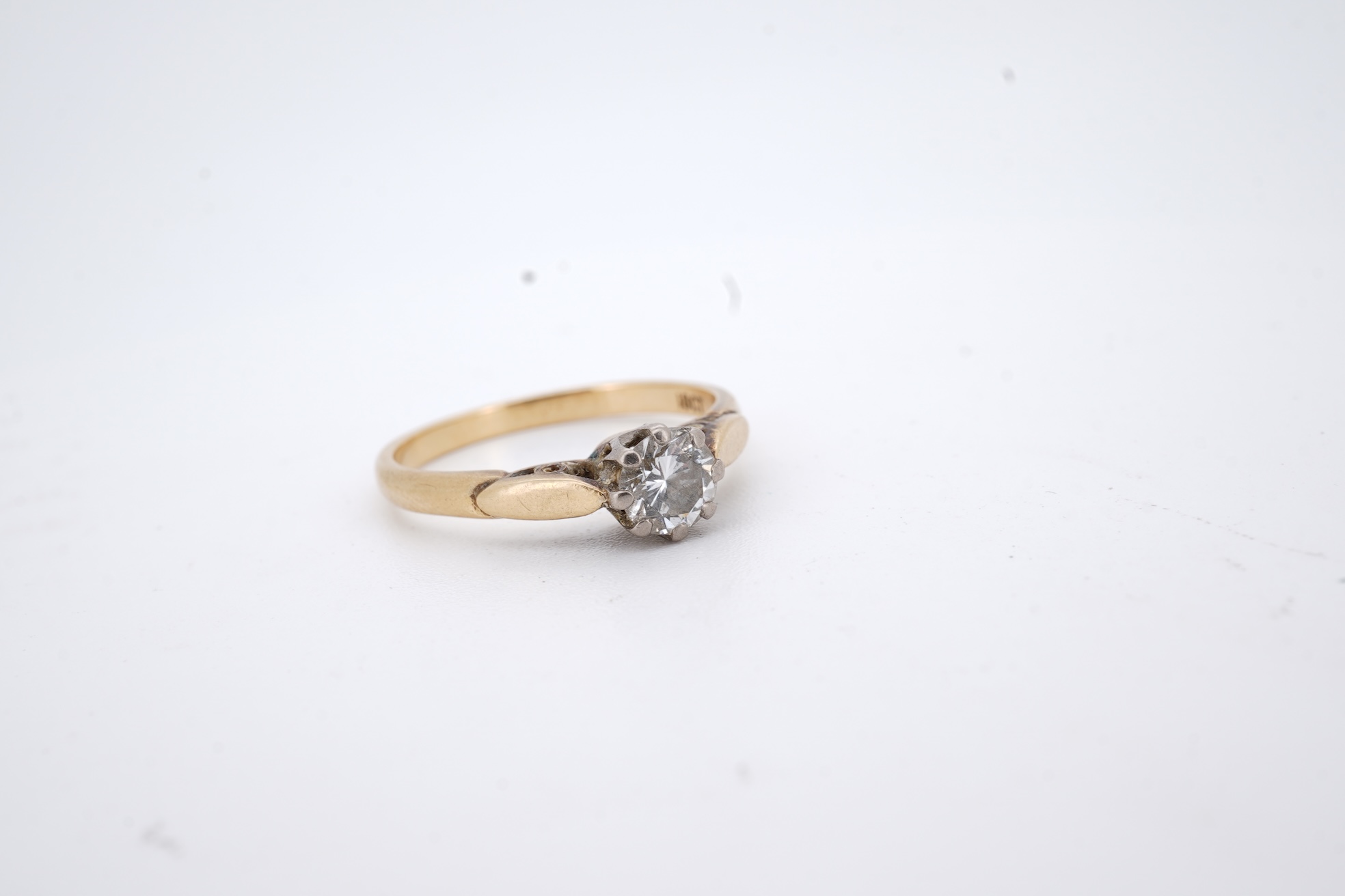 An 18ct and solitaire diamond set ring, the stone weighing approximately 0.30ct, size N, gross weight 2.8 grams.